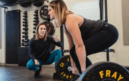 Physical Therapist with patient assisting workout