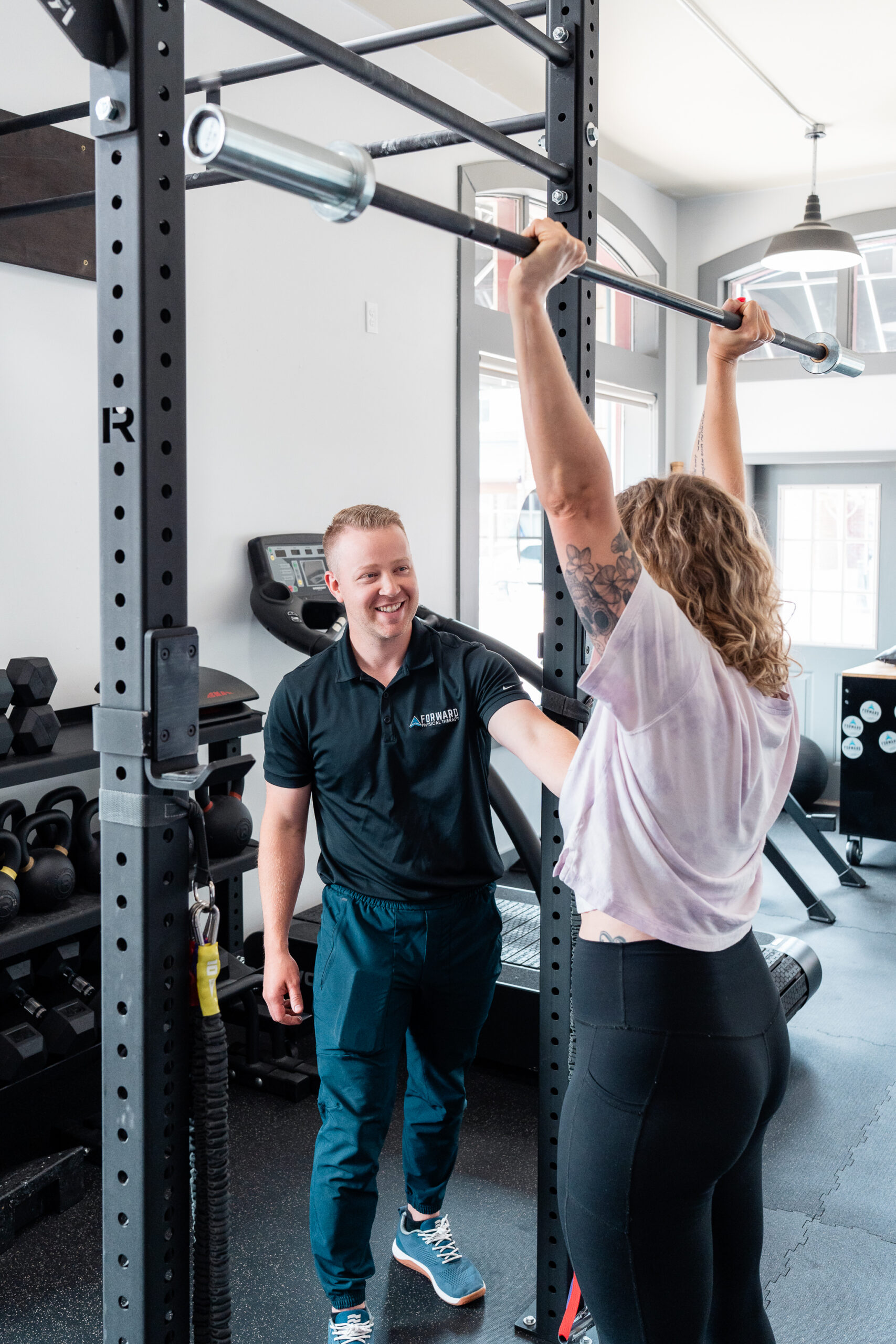 Physical therapist supervising strength training at Forward Physical Therapy